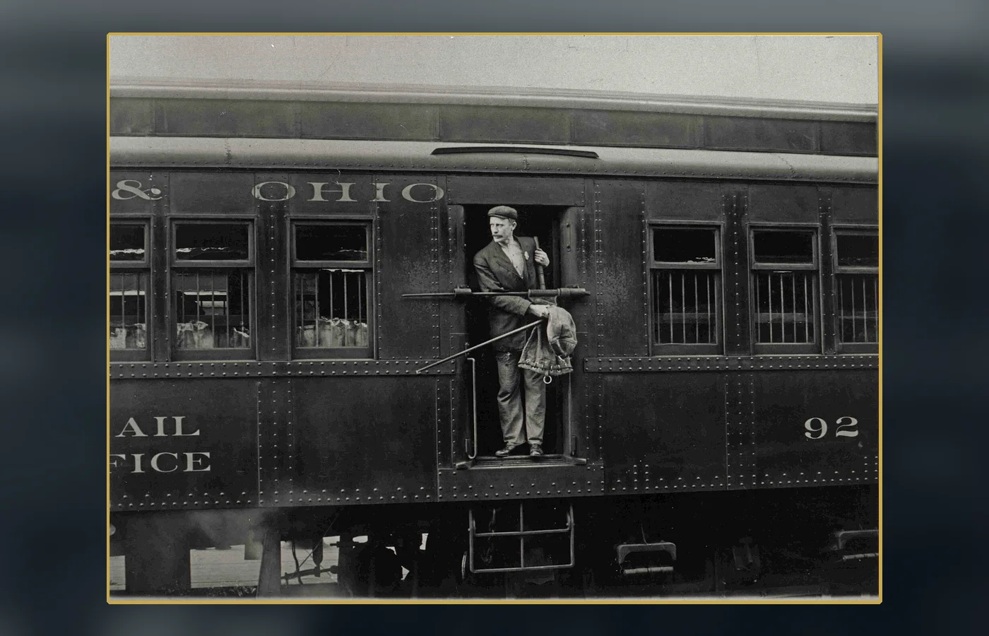 A Railway Post Office clerk sorting mail inside a moving mail car