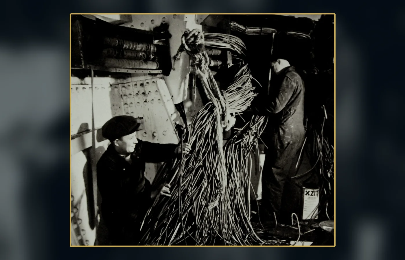 Workers installing shipboard degaussing cable in 1942—the real magnetic-signature technology often confused with invisibility